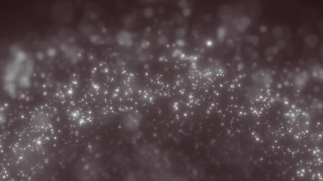 Soft gray particle field with glowing white dots and blurred bokeh