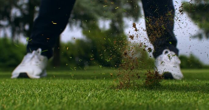 Super Slow Motion Close Up Of Sand Flying After Golf Bunker Shot. Concept Of Dynamic Sports Background. Abstract close-up of sand particles suspended in motion after a bunker shot.