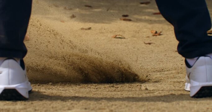 Super Slow Motion Close Up Of Sand Flying After Golf Bunker Shot. Concept Of Dynamic Sports Background. Abstract close-up of sand particles suspended in motion after a bunker shot.