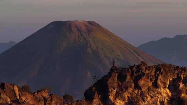 Majestic Mount Sumbing at Sunrise with Rocky Foreground in Central Java, Indonesia
