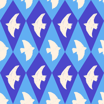 Bird harlequin seamless pattern with cream silhouettes on blue argyle rhombus. Chalk doves form a geometric seamless vector bird pattern for fabric and wallpaper. Classic print for aop and surface.