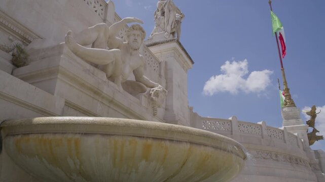 Marble Fountain Sculpture and Italian Flag at Victor Emmanuel II Monument Rome Italy Summer Landmark Scene Shot with Cinema Camera