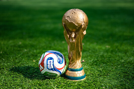 May 7, 2026, United States. The trophy of the 2026 FIFA World Cup and the official Adidas Trionda ball on the green lawn of the stadium.