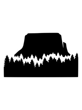 Devils Tower National Monument Silhouette with Pine Forest Landscape