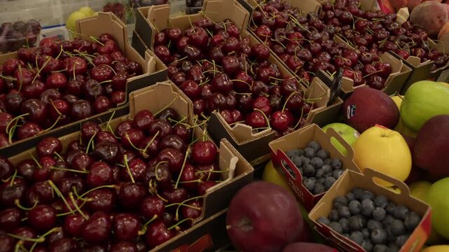 Fresh Cherries and Seasonal Fruit Display at Market Stall in Rome Italy Summer Shot with Cinema Camera