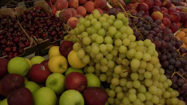 Grapes and Fresh Seasonal Fruit Display at Market Stall in Rome Italy Summer Shot with Cinema Camera