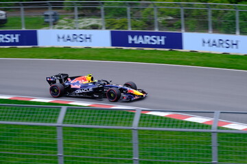 Obraz premium May 24, 2025, Montreal, Canada: Red Bull Racing Formula 1 car during by Hadjar or Verstappen, demonstration run at Circuit Gilles Villeneuve. g.