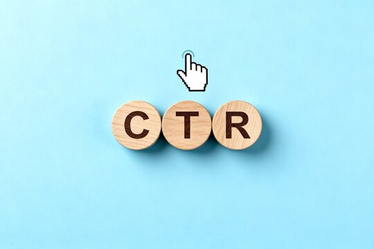 Wooden Blocks Spell CTR with Hand Cursor on Blue Background
