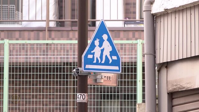 School zone road sign in a Japanese residential area
