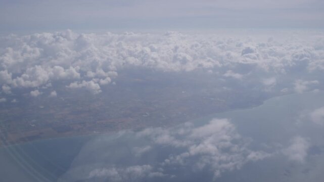 Cloudscape Viewed From Airplane Window Above Europe Shot with Cinema Camera