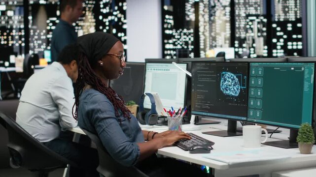 Female programmer using large language model application to get help with coding tasks. woman interacting with AI LLM chatbot PC AI chatbot software on PC.