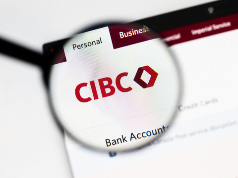 Milan, Italy 2026, 20 Apr Closeup of CIBC Canadian Imperial Bank website on a laptop screen. CIBC Canadian Imperial Bank logo under a magnifying glass.