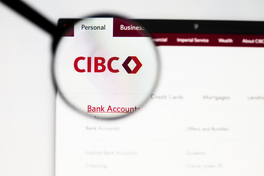 Milan, Italy 2026, 20 Apr Closeup of CIBC Canadian Imperial Bank website on a laptop screen. CIBC Canadian Imperial Bank logo under a magnifying glass.