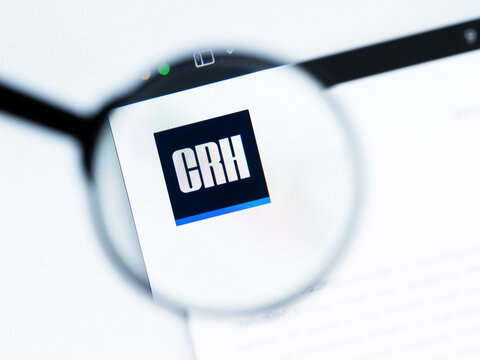 Milan, Italy 2026, 20 Apr Closeup of CRH website on a laptop screen. CRH logo under a magnifying glass.