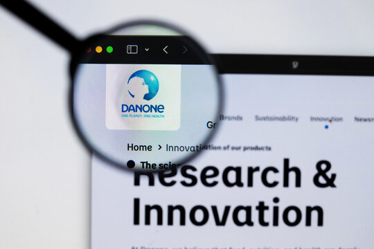 Milan, Italy 2026, 20 Apr Closeup of Danone website on a laptop screen. Danone logo under a magnifying glass.