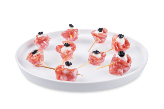 Mozzarella sausage olive canape in the form of eye in a plate on a white isolated background