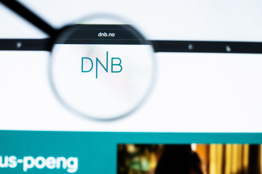 Milan, Italy 2026, 20 Apr Closeup of DNB Bank website on a laptop screen. DNB Bank logo under a magnifying glass.