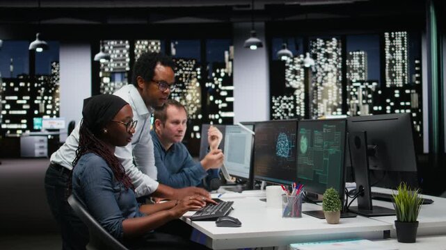 Engineering team in office fight ddos attack from hacker, trying to protect servers from malware with debugging and troubleshooting context.