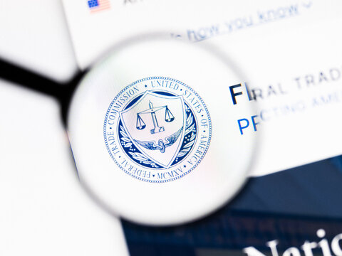 Milan, Italy 2026, 20 Apr Closeup of Federal Trade Commission website on a laptop screen. Federal Trade Commission logo under a magnifying glass.