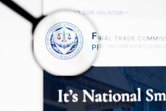 Milan, Italy 2026, 20 Apr Closeup of Federal Trade Commission website on a laptop screen. Federal Trade Commission logo under a magnifying glass.