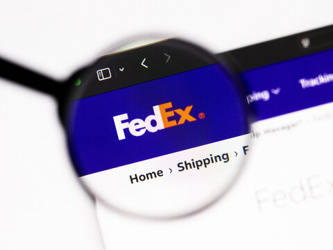 Milan, Italy 2026, 20 Apr Closeup of FedEx website on a laptop screen. FedEx logo under a magnifying glass.
