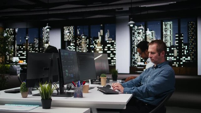 Tech agency computer scientist using AI to optimize software performance in office late at night. IT specialist at work using deep learning to analyze code and do debugging for debugging workflows.
