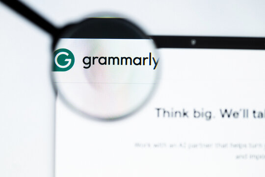 Milan, Italy 2026, 20 Apr Closeup of grammarly website on a laptop screen. grammarly logo under a magnifying glass.