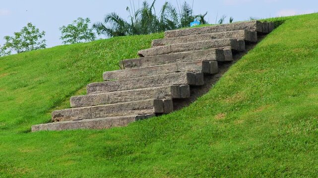 The stairs are made of concrete slabs ,on the golf course