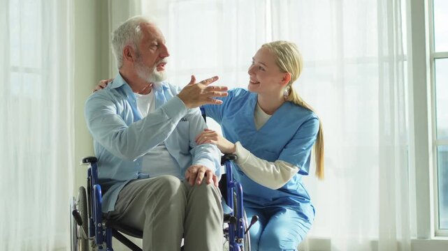 Help support retirement healthcare. Nurse helping old man in wheelchair. Patient and woman in nursing home for medical caregiver. Nurse taking care of paralyzed man in chair for people with disability