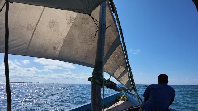 Man sailing on a dhow, Nampula Province, Island of Mozambique, Mozambique