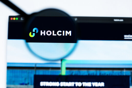 Milan, Italy 2026, 20 Apr Closeup of Holcim website on a laptop screen. Holcim logo under a magnifying glass.