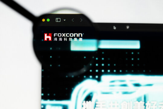 Milan, Italy 2026, 20 Apr Closeup of Hon Hai Precision FOXCONN website on a laptop screen. Hon Hai Precision FOXCONN logo under a magnifying glass.