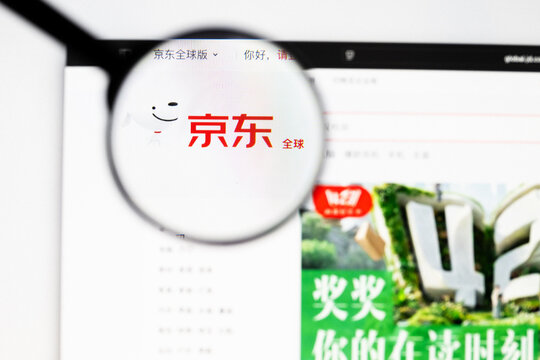 Milan, Italy 2026, 20 Apr Closeup of JD.com website on a laptop screen. JD.com logo under a magnifying glass.