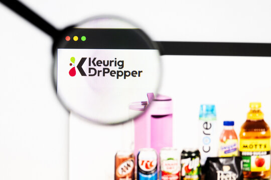 Milan, Italy 2026, 20 Apr Closeup of Keurig Dr Pepper website on a laptop screen. Keurig Dr Pepper logo under a magnifying glass.