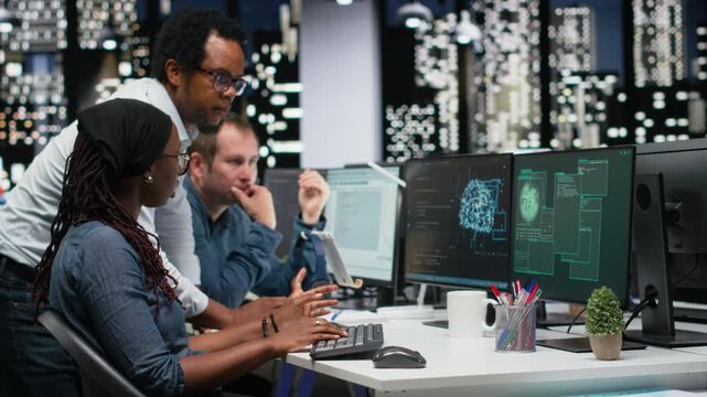 Engineering team in office fight ddos attack from hacker, trying to protect servers from malware with debugging and troubleshooting context.