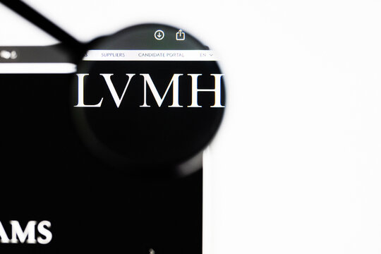 Milan, Italy 2026, 20 Apr Closeup of LVMH Louis Vuitton Moet Hennessy website on a laptop screen. LVMH Louis Vuitton Moet Hennessy logo under a magnifying glass.