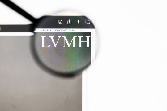Milan, Italy 2026, 20 Apr Closeup of LVMH Louis Vuitton Moet Hennessy website on a laptop screen. LVMH Louis Vuitton Moet Hennessy logo under a magnifying glass.