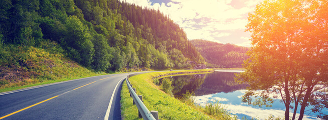 Driving a car on a mountain road along the fjord. Nature Norway © vvvita