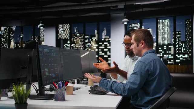 Engineering team in tech office developing apps with AI. Teamworking colleagues using machine learning to do coding, debugging apps to resolve issues.