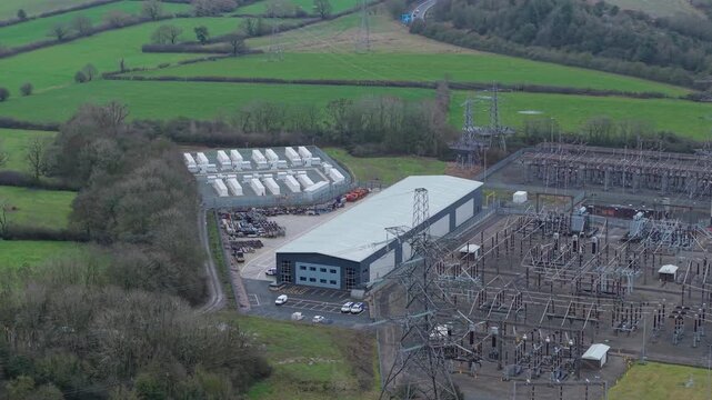 Cinematic aerial view of utility scale battery energy storage system BESS facility in the United Kingdom