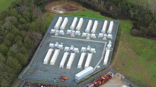 Drone shot of a modern clean tech power generation and battery storage facility in the British countryside