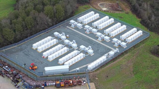 Drone view of sustainable power grid infrastructure showcasing containerized commercial battery storage UK