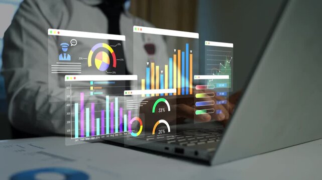 Business person using a laptop with holographic data charts and graphs on a transparent screen, Business analytics dashboard on laptop screen