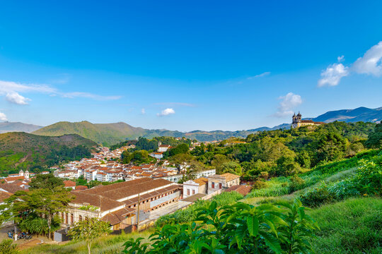 The city of Ouro Preto between the mountains and typical vegetation of Minas Gerais.