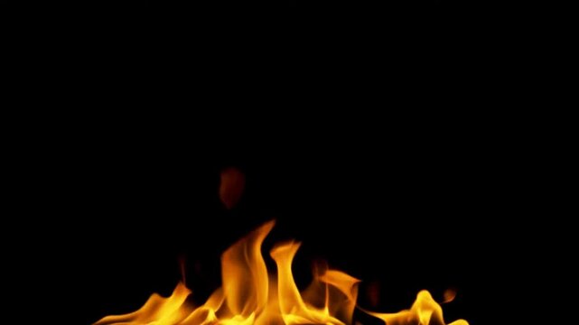 Closeup of vibrant orange flames dancing against a stark black background 1.