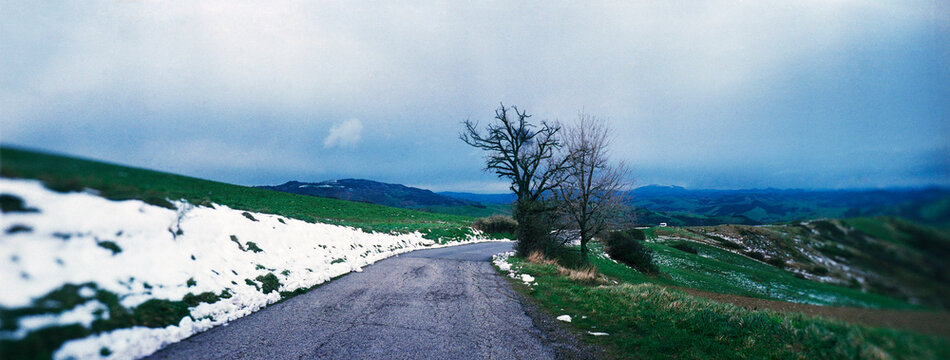 Panoramic view of mountain road winding through the countryside of the San Marino, Europe