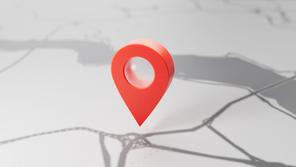 A minimal red location pin stands on a grayscale map, creating a modern navigation-themed scene. © gonul
