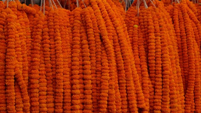 Vibrant marigold garlands brightening festive market stalls