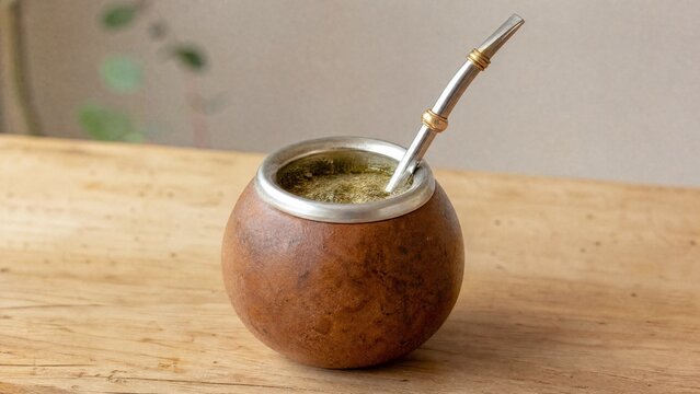 traditonal. A traditional mate gourd with yerba mate leaves and a bombilla straw inside. bar promotions, beverage menus, designed for product packaging and bar promotions, inspires menu design.