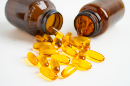 Fish oil or Cod liver oil gel in capsules with omega 3 vitamins, supplementary healthy food.